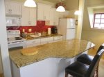 Full kitchen with granite countertops